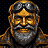 Portrait of Old Mott: goggles pushed up on his forehead, a grey beard and a wide grin.